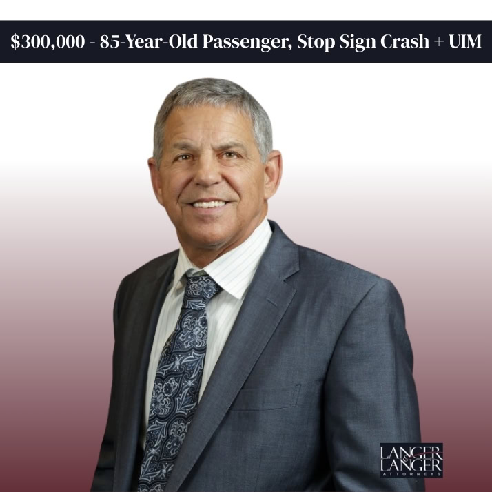 300000 85-Year-Old Passenger, Stop Sign Crash UIM