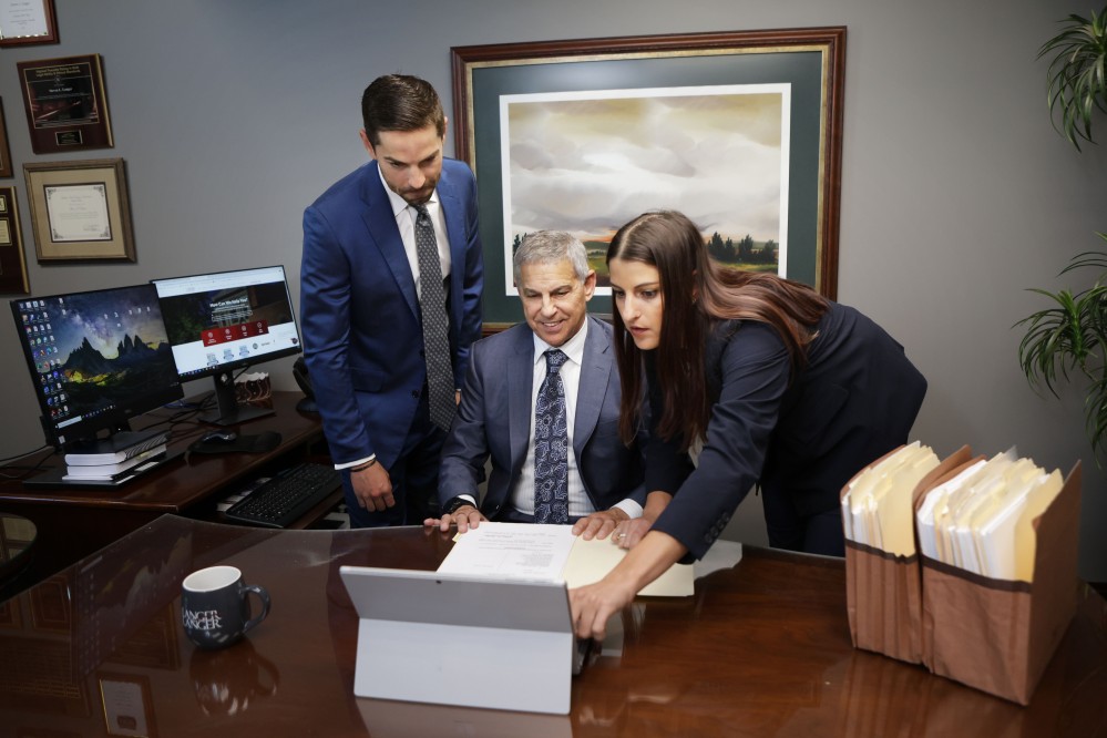 Attorneys Robert A. Langer, Steven L. Langer and Sara A. Langer at work in their office