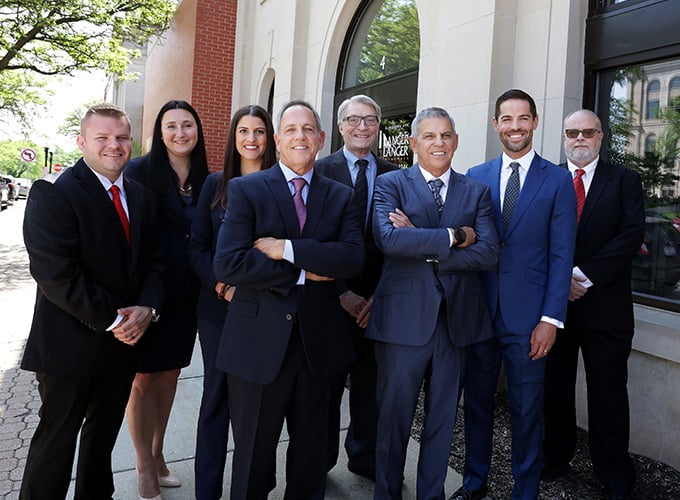 Group photo of the attorneys at Langer & Langer outside of their office